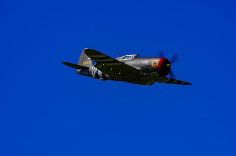An RC model of a Republic P-47 Thunderbolt during a demonstration as part of an air show at the