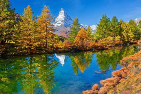Matterhorn 4478 m with reflection in Lake Grindji in autumn, Zermatt, Mattertal, Valais,