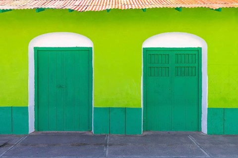Colorful colonial architecture of historic center of Flores, Guatemala