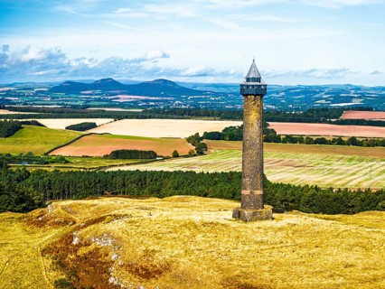 Waterloo Monument over Scottish fields and farms from a drone, Jedburgh, Scotland, UK