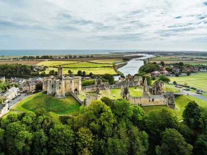 Warkworth Castle over River Coquet from a drone, Warkworth, Northumberland, England, United Kingdom