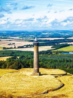 Waterloo Monument over Scottish fields and farms from a drone, Jedburgh, Scotland, UK