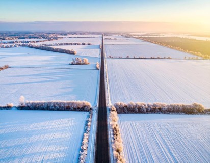Bird Eye Perspective of Frost Covered Farmland. Seasonal Agricultural Scenery, winter and autumn