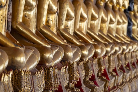 Gilded Buddha statues (Bhumispara mudra: Buddha Gautama at the moment of enlightenment), Wat Suthat