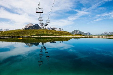 Mountain landscape with reservoir and chairlift, Saloberkopf, Warth, Bregenzerwald, Vorarlberg,