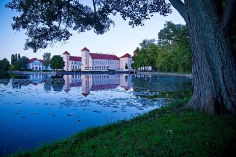 Rheinsberg Castle, lakeside with Lake Grienerick at night, prime example of Friederician Rococo,