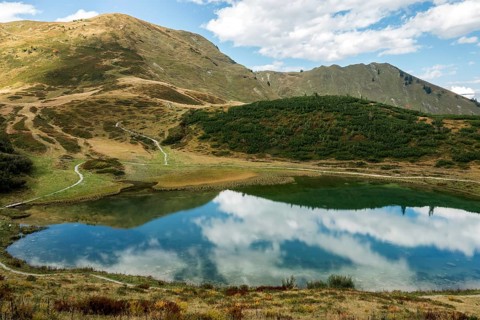 Schlappoldkopf and Söllerkopf are reflected in Schlappoldsee, Fellhorn, Oberstdorf, Oberallgäu,