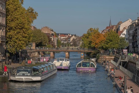 Tourist boat docks on the Ill and transports visitors who enjoy the view of Strasbourg's sights and