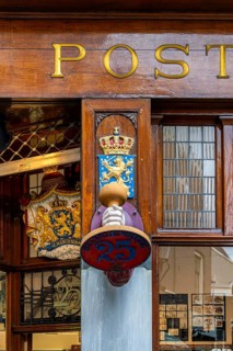 The Posthumus Shop, stationery boutique, shop façade with decorative stamp motifs, St. Luciensteeg,