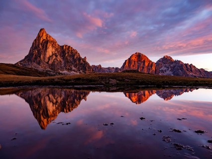 Alpine glow, reflection of the Ra Gusela and Tofane mountains at dawn, Passo di Giau, Giau Pass,