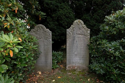 Cemetery of St John's Church with gravestones telling the story of seafarers, known as talking