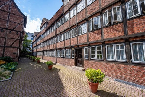 Facades of the historic brick buildings, inner courtyard, view over the city, Peterstraße,
