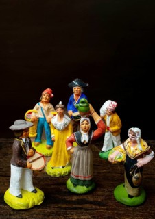 Colorful Provençal terracotta figurines represent traditional characters from rural life. Each