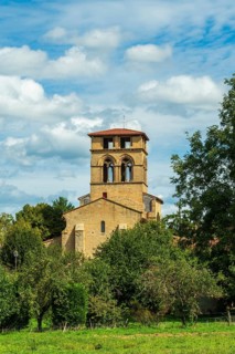 Mailhat village. Romanesque church with its square bell tower, Puy de Dome department,