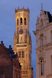 Illuminated Belfry in the historic city centre of Bruges in the evening light, Belfort on the Grote