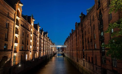 Illuminated warehouses in Hamburg's Speicherstadt, blue hour, Hamburg, Germany