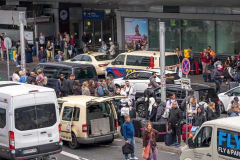 Ahead of Terminal B, many thousands of people set off on holiday on the first day of the North