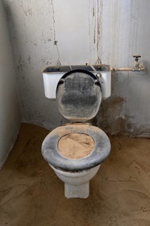Toilet full of sand in the former hospital, Kolmanskop, restricted diamond area, Karas region,