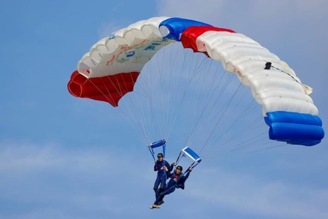 Two parachutists during an aerial acrobatic performance as part of an air show at the Rossfeld in