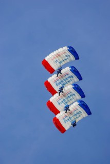 Parachutists during an aerial acrobatic demonstration as part of an air show on the Rossfeld in