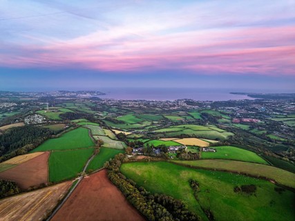 Twilight Sky of Torbay farms and fields from a drone, Totnes, Berry Pomeroy, Devon, England, United