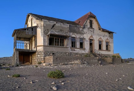 Dilapidated accountant's house in the desert sand, blue hour, Kolmanskop, near Lüderitz, Karas
