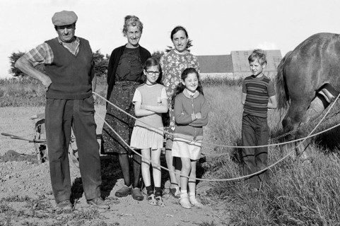 French farmer family with horse in the field, historical photograph from the 1970s, black and