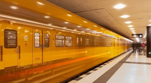Dynamic scene of a Berlin underground in typical yellow colour, long exposure with blur effect,