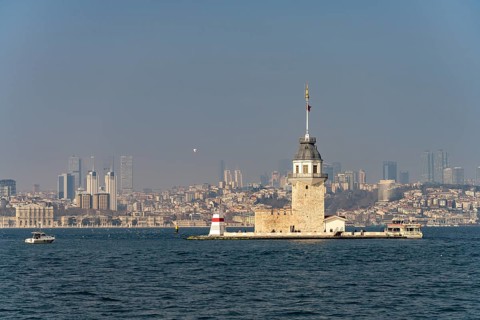 The Maiden Tower lighthouse, Leander Tower or Maiden Tower in front of the skyline of Istanbul,