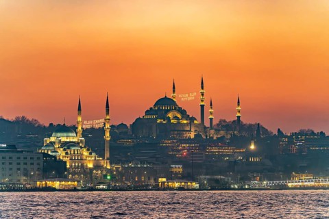 The New Mosque Yeni Cami and the Süleymaniye Mosque at dusk, Eminönü, Istanbul, Turkey