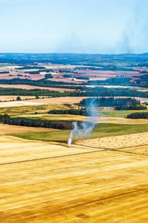 Scottish fields over Waterloo Monument from a drone, Jedburgh, Scotland, UK