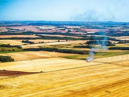 Scottish fields over Waterloo Monument from a drone, Jedburgh, Scotland, UK