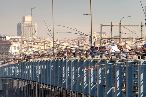 Angler on the Galata Bridge in Istanbul, Turkey