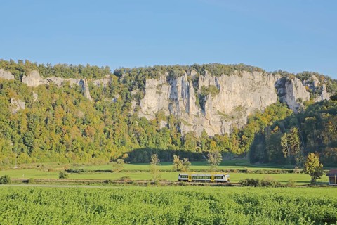 Railway line with train and view of rock formations, landscape, rock formations, rock cliffs,