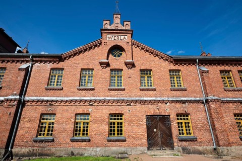 Brick façade with inscription Werla, former paper factory and mill for the production of groundwood