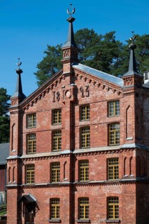 Brick façade with inscription 1893, former paper factory and mill for the production of groundwood