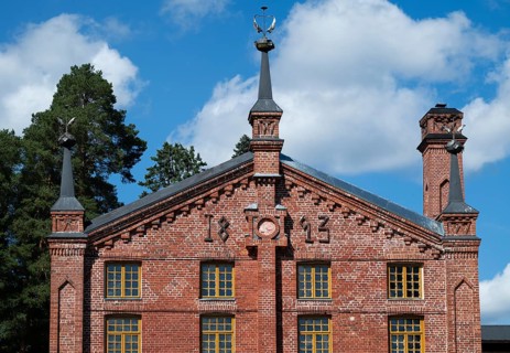 Multi-storey brick façade with inscription 1893, former paper factory and mill for the production