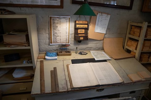 Desk in an office, former paper factory and mill for the production of groundwood pulp board,