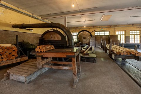 Historic circular saws and tree trunks, former paper factory and mill for the production of