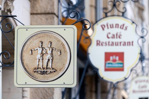 Façade signs on the Pfunds dairy, Neustadt, Dresden, Saxony, Germany
