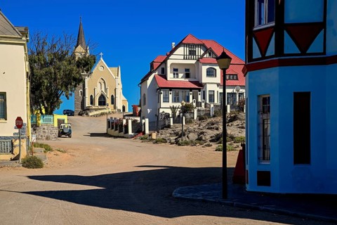Colonial house facade in the Bergstraße, in the background the rock church, Lüderitz, Karas region,