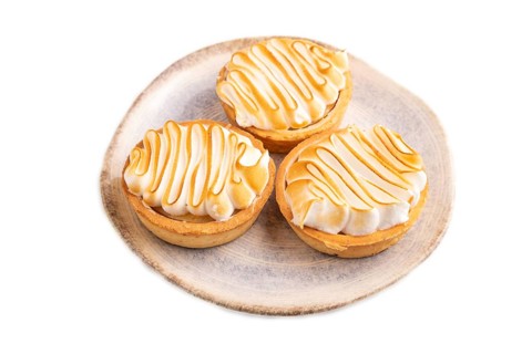 French lemon tart with meringue isolated on white background, side view, close up
