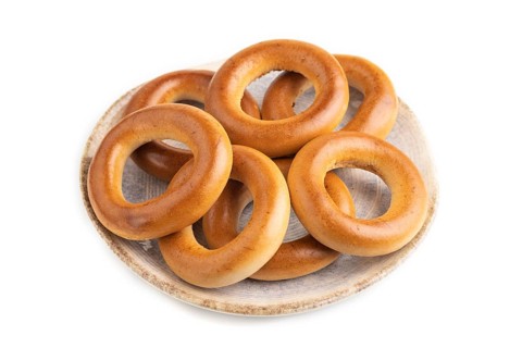 Homemade Ring Bagel isolated on white background. side view, close up