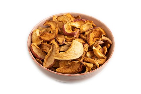 Dried Apples in ceramic bowl isolated on white background. Side view, close up. healthy food,