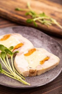 Chicken, egg and dried apricot meatloaf, microgreen on brown wooden. Diet, healthy eating. side