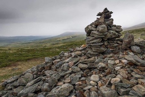 Stones deposited by pilgrims, stone pyramid, Allmannrøysa, Olav's Way or Olavsleden, old Kongevegen