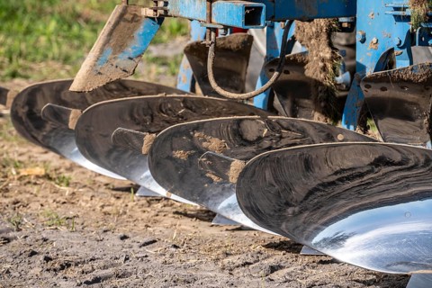 Plough, for ploughing a field, field, ploughshares, agricultural technology, shiny stainless steel,