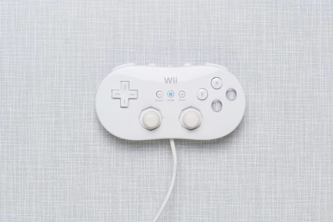 Top shot of a Wii Classic controller on a white Formica plate
