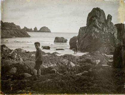 Magic lantern slide two boys playing on rocky beach circa 1900, Moulin Huet Bay, Guernsey, Channel