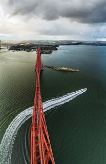 Horizontal panorama of Rain clouds over Forth Bridge from a drone, Queensferry Crossing, Forth